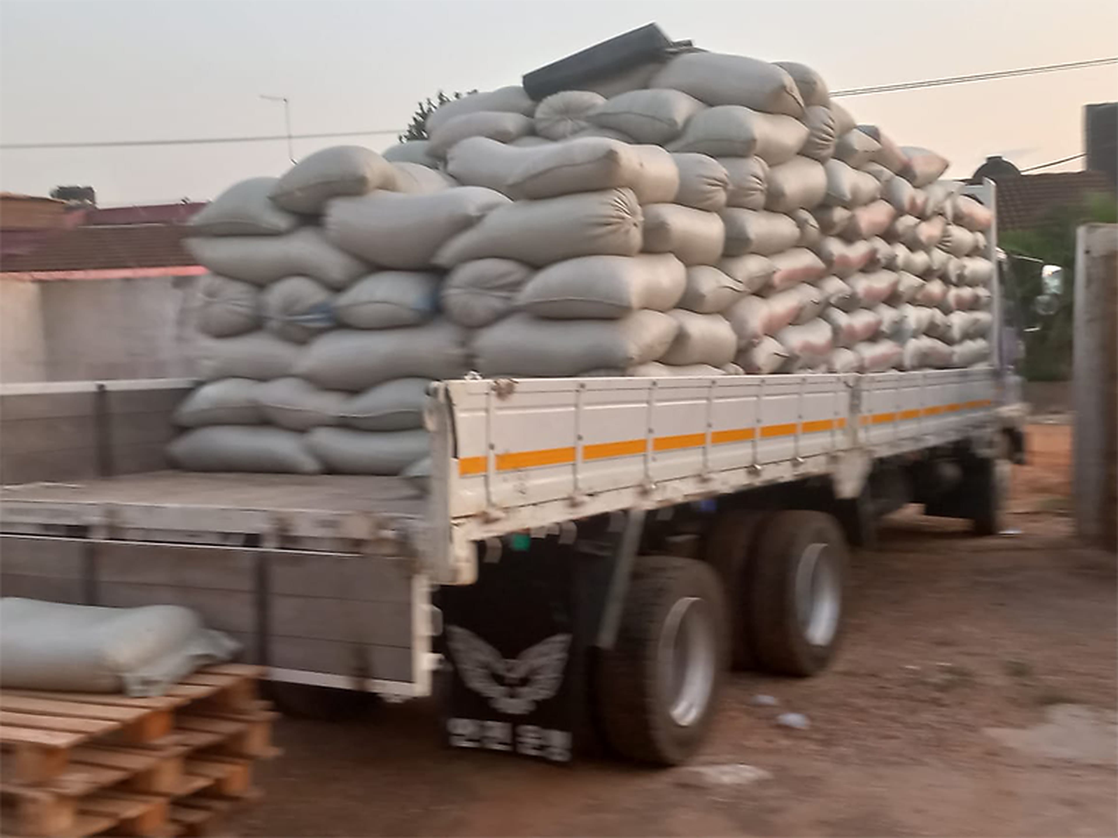 A truck loaded with bagged grain at an iFeed Agribusiness & Farms distribution point
